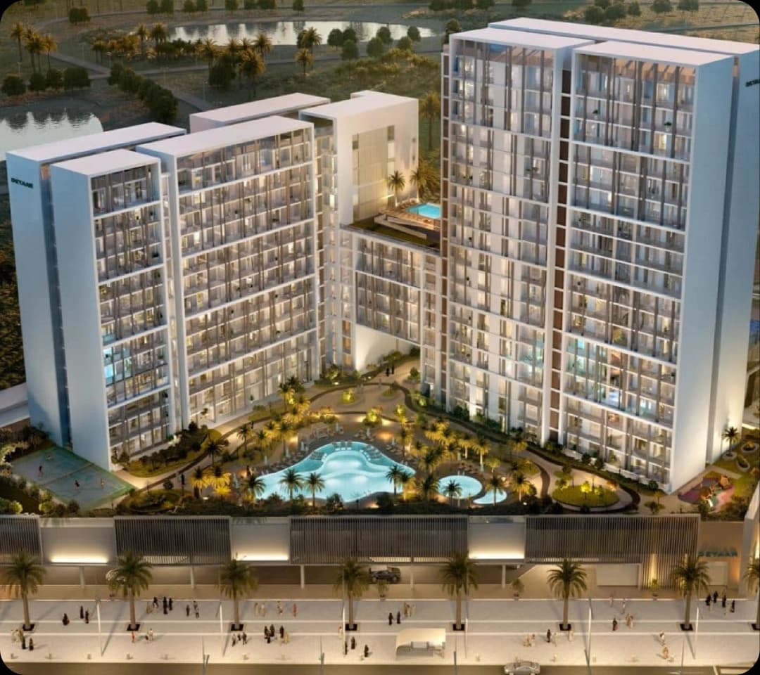 Modern high-rise apartment complex with pools and landscaping