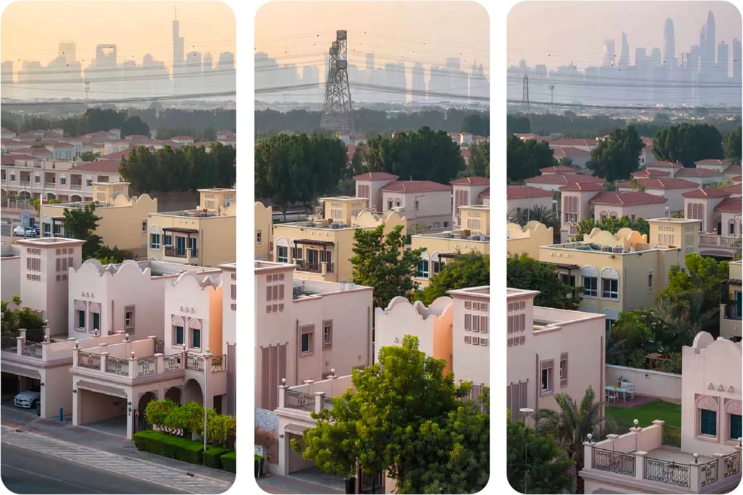 Aerial view of villas with Dubai skyline in the background