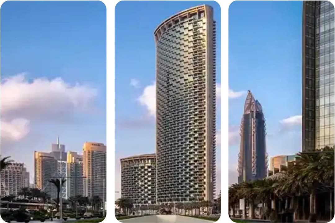 المباني البرجية الأيقونية لشركة إعمار في أفق دبي تحت السماء الزرقاء