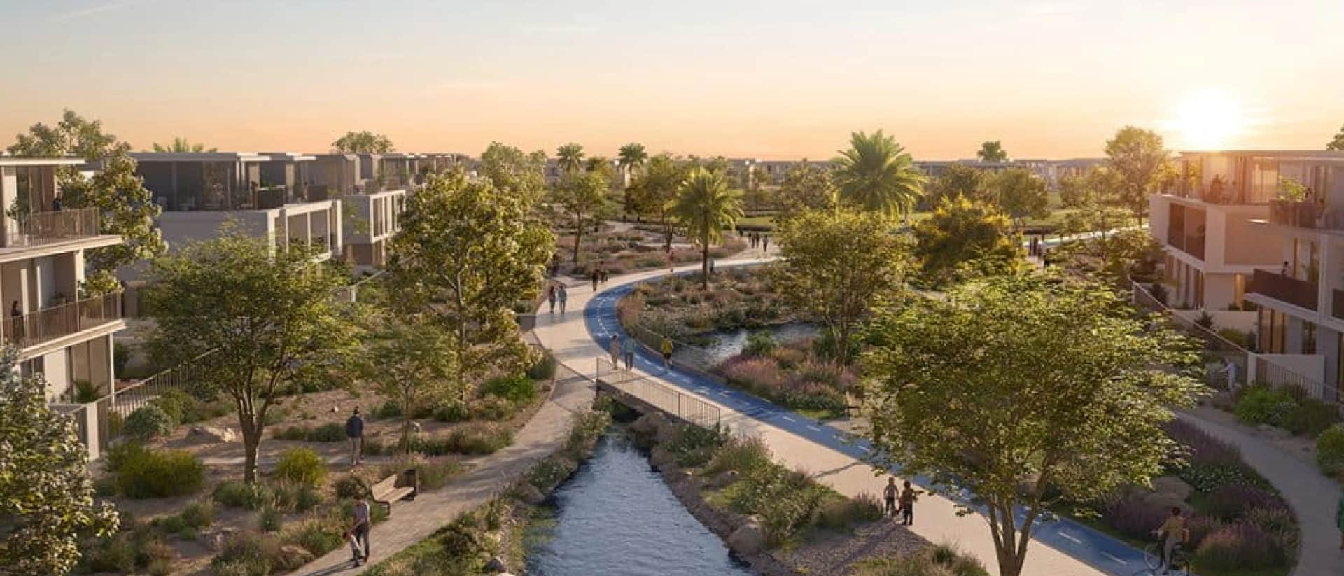 Modern community, paths, water, homes at sunset