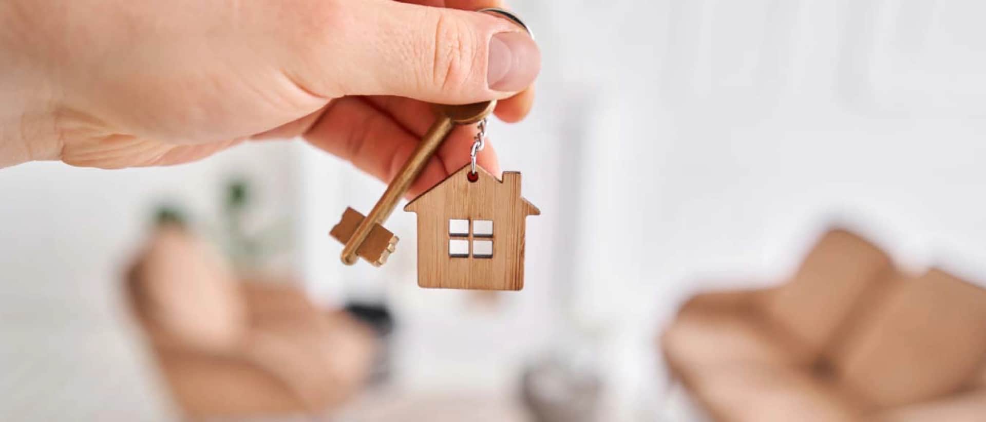 Miniature house on architectural blueprints