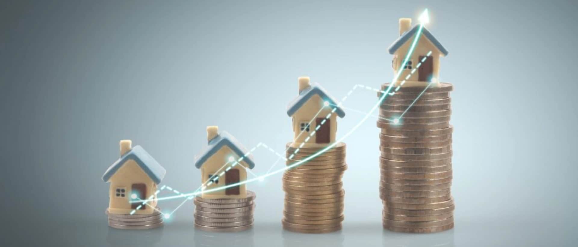 Rising stacks of coins with small houses on top, showing property value growth
