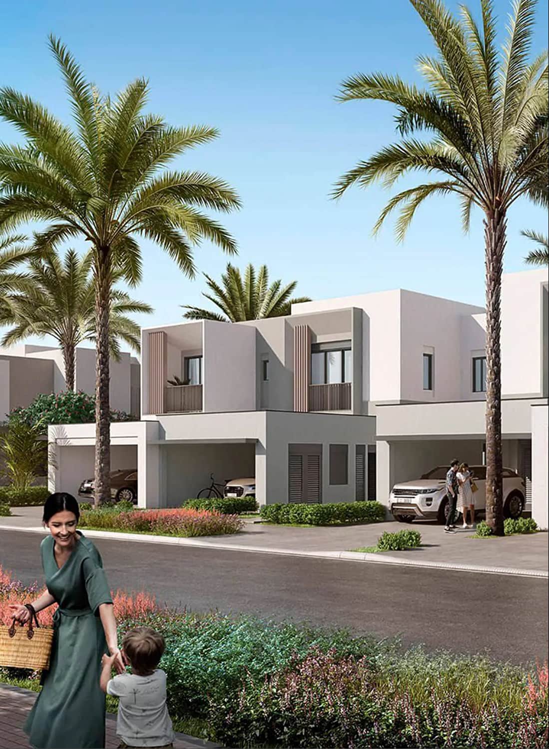 Family walking in front of a modern townhouse with palms