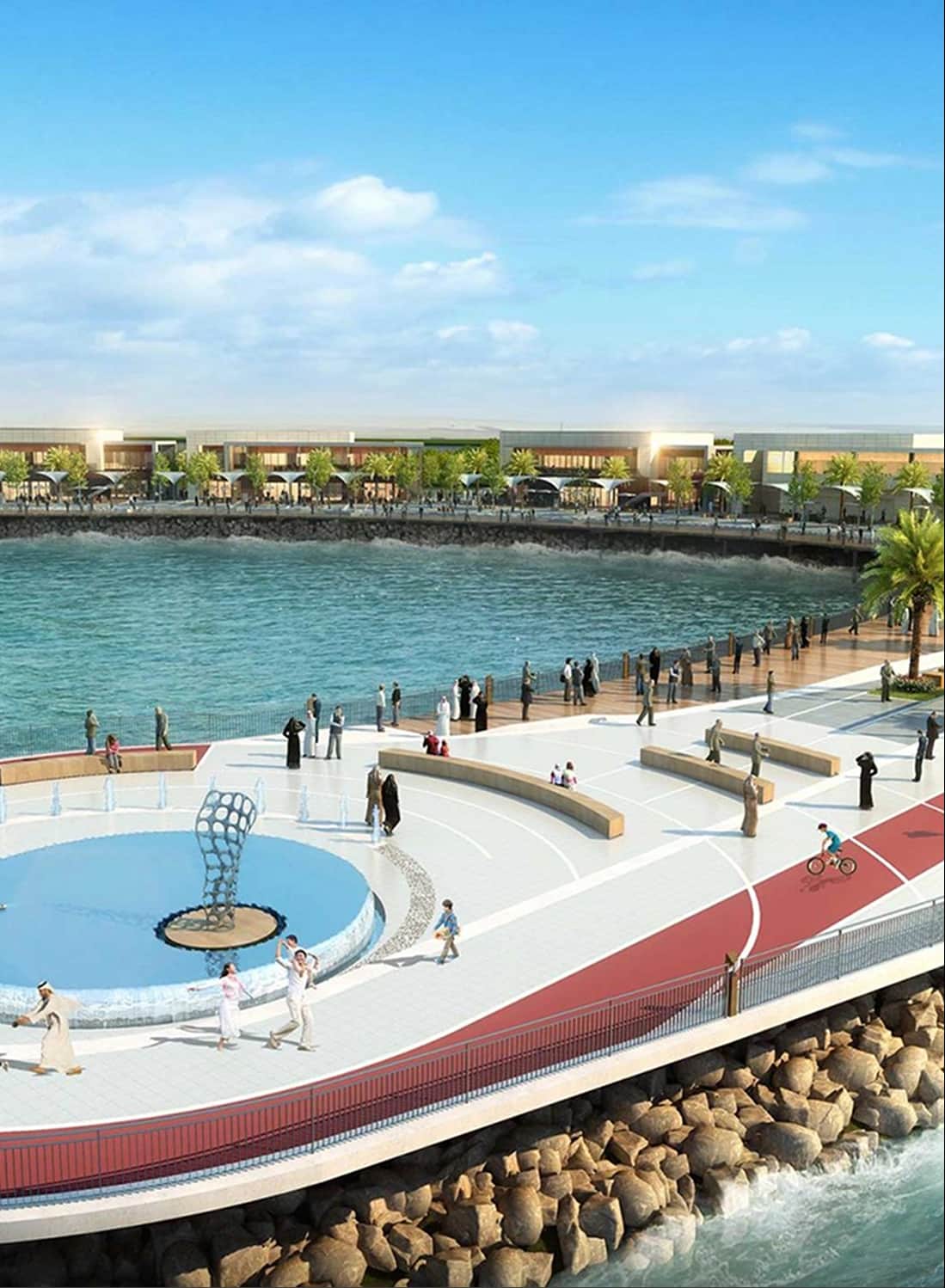 People walking and cycling by a waterfront promenade