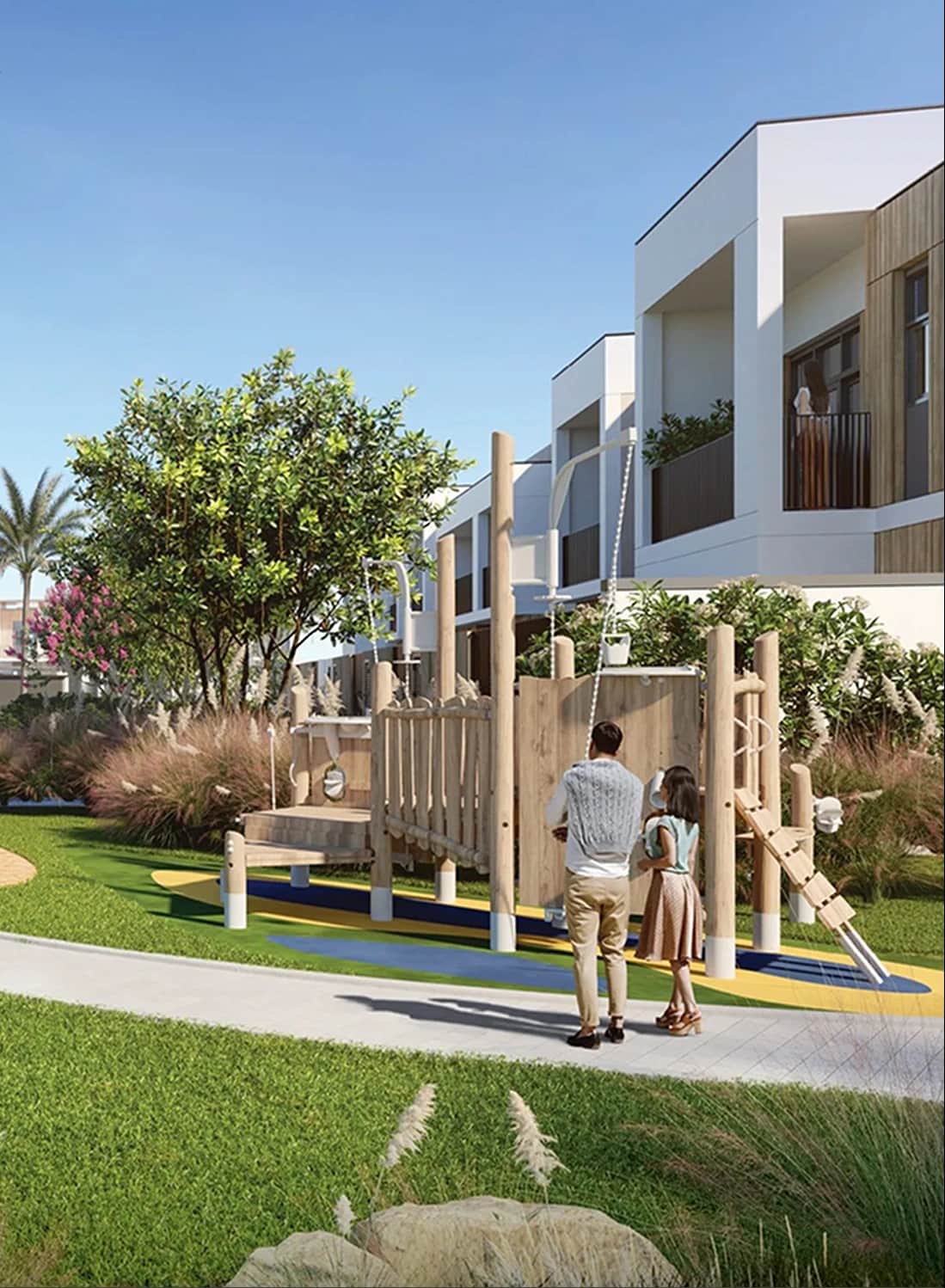 Wooden playground with a child, parent, and townhouses
