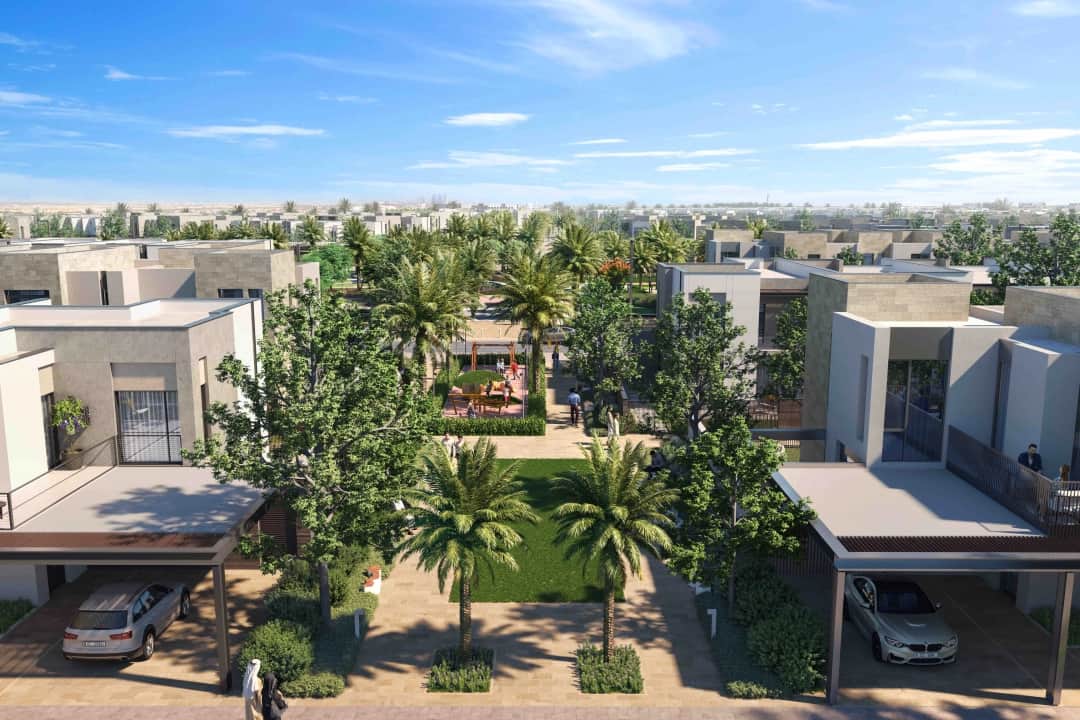 Aerial view of a residential community with palm trees and walking paths