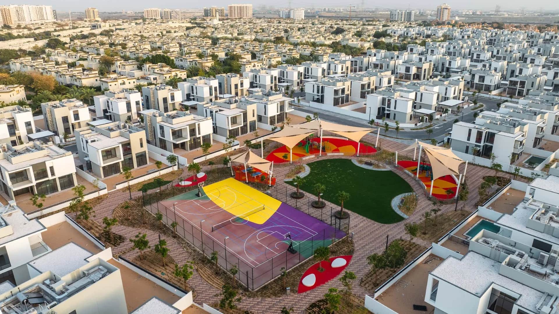 Aerial view of colorful playgrounds and residential homes