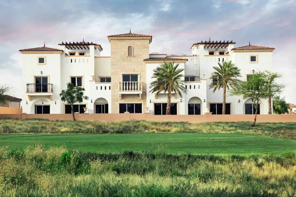 Luxurious Mediterranean golf resort villa overlooking a lush fairway, with a stately design and palm tree