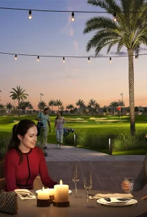 People enjoying dinner at the park side restaurants of Fairway villas 2 at emaar south