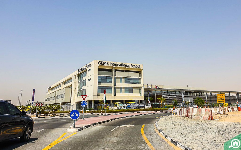 a road with a School in Emaar south