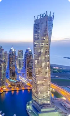 Sky scrapper at Dubai Marina with yachts standing beneath