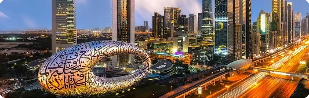 Futuristic Museum of the Future in Dubai with illuminated skyscrapers in the background.