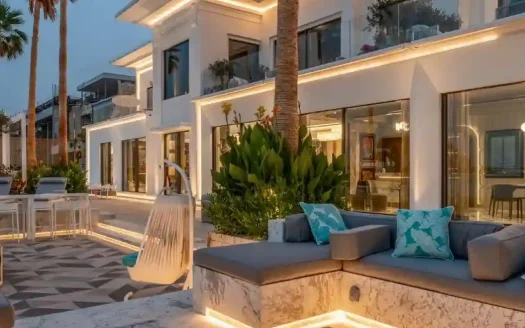 Luxury outdoor seating area with elegant lighting and modern architecture.